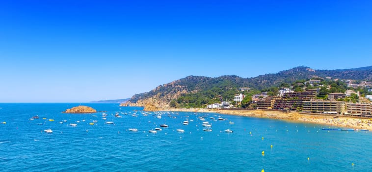 The panaramic view from the shore to the sea and boats