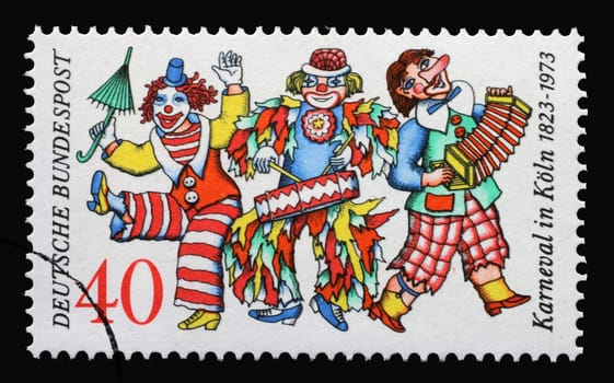 A stamp printed in Germany issued for the 150th anniversary of Cologne Carnival shows three clowns, circa 1972