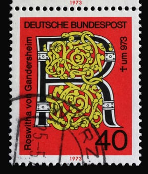 A stamp printed in Germany shows "R"" for Roswitha von Gandersheim, Millenary of the death of Roswitha of Gandersheim, Germany’s first poetess, circa 1973"
