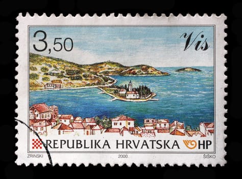 A stamp printed in Croatia shows City view of Vis with Peninsula Pirovo, Series Croatian cities, circa 2000