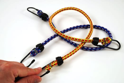 Stock pictures of bungee cords with steel hooks of several colors