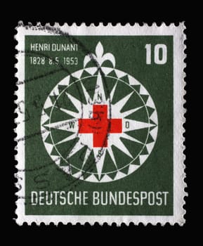 Stamp printed in Germany, shows symbol of the Red Cross in a stylized wind rose, circa 1953