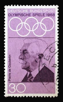 Stamp printed in Germany showing portrait of Pierre de Coubertin, 1968 Summer Olympics, the Games of the XIX Olympiad, Mexico City, circa 1968
