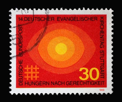 Stamp printed in Germany showing several circles in orange, 4th German Evangelical church day Stuttgart, hunger for justice, circa 1969