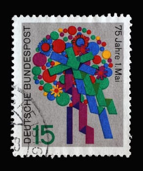 Stamp printed in Germany showing a bouquet of flowers on the occasion of Labor Day. 75th Anniversary of the 1st of May celebration, circa 1965