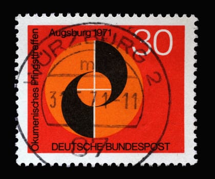 Stamp printed in Germany shows Congress emblem of Ecumenical Meeting at Pentecost of the German Evangelical and Catholic Churches in Augsburg, circa 1971