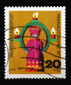 Stamp printed in Germany showing Wooden turned Christmas Angel, circa 1971