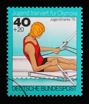 A stamp printed in Germany shows Rowing, single sculls, Youth training for the Olympics, circa 1976