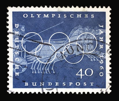 Stamp printed in Germany showing Chariot Race, Sport Scene from Greek vase paintings, Olympic rings and promotes 17th Olympic Games in Rome, circa 1960