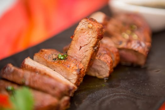 organic fresh ripe roasted beef meat with sauce on plate