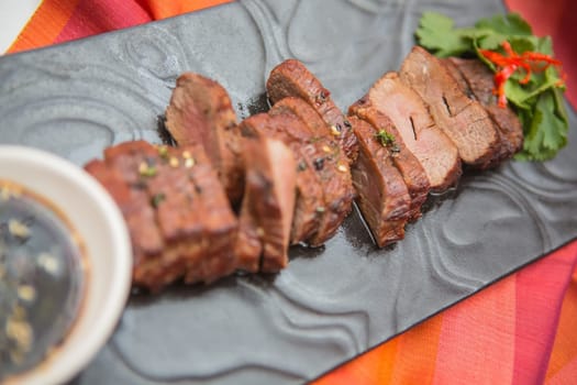 organic fresh ripe roasted beef meat with sauce on plate