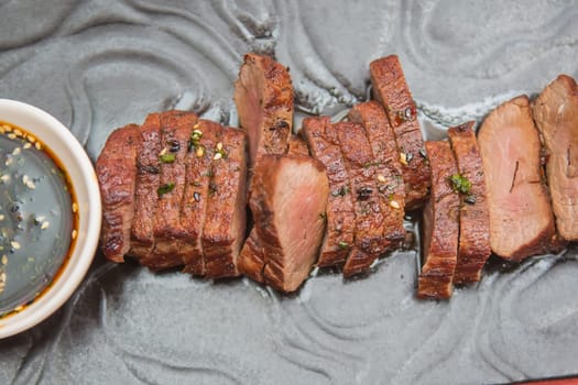 organic fresh ripe roasted beef meat with sauce on plate