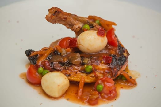 roasted chicken leg with vegetables, herbs and eggs