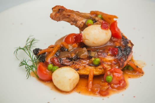 roasted chicken leg with vegetables, herbs and eggs