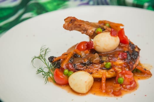 roasted chicken leg with vegetables, herbs and eggs