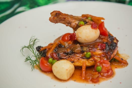 roasted chicken leg with vegetables, herbs and eggs