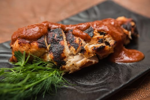 the cut chicken fillet baked in spices and tomato sauce,international kitchen
