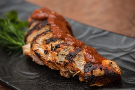 the cut chicken fillet baked in spices and tomato sauce,international kitchen