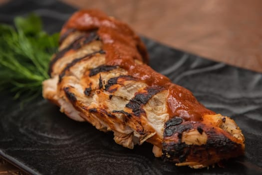 the cut chicken fillet baked in spices and tomato sauce,international kitchen