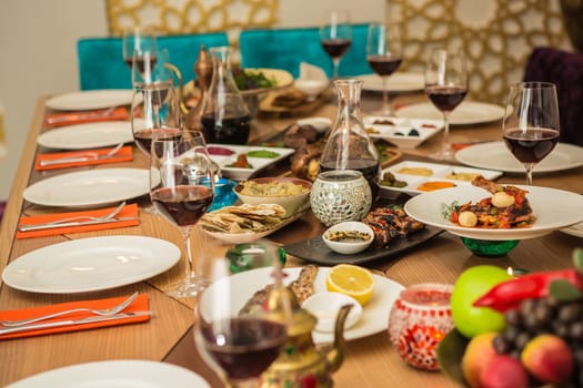 Served for a banquet table. Wine glasses with napkins, glasses and salads.