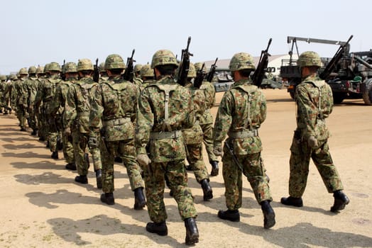 Japanese armed marching soldiers with weapon