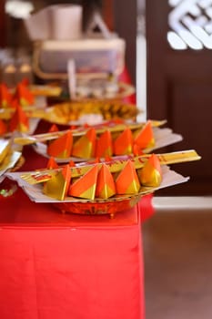 Small dish on a red tablecloth in the Asian style