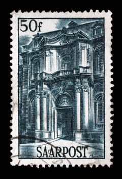 Stamp from Germany area Saar shows Mettlach Abbey portal, circa 1948