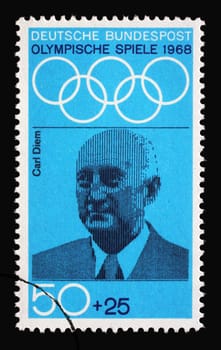Stamp printed in Germany showing portrait of Carl Diem, sports organizer and teacher, 1968 Summer Olympics, the Games of the XIX Olympiad, Mexico City, circa 1968