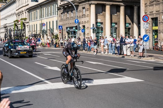 MILAN, ITALY - MAY 30: last stage of Giro 2021, Romain Bardet competitor and DSM following car at high speed during individual time trial in city streets, shot on may 30, 2021 Milan, Italy.