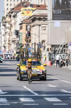 MILAN, ITALY - MAY 30: last stage of Giro 2021, Tobias Foss competitor and Jumbo-Visma Team following car at high speed during individual time trial in city streets, shot on may 30, 2021 Milan, Italy.