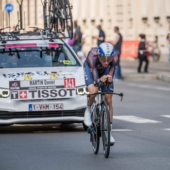 MILAN, ITALY - MAY 30: last stage of Giro 2021, Daniel Martin competitor and Isreal Start-up Nation Team following car at high speed during individual time trial in city streets, shot on may 30, 2021 Milan, Italy.