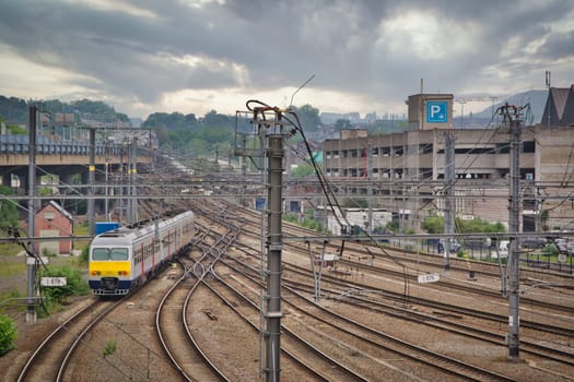 Liege, Belgium, June 2021: Belgian NMBS SNCB passenger train leaving the station of Liege Guillemins and changing tracks