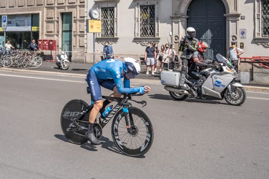 MILAN, ITALY - MAY 30: last stage of Giro 2021, Dario Cataldo competitor of Moviestar Team  at high speed during individual time trial in city streets with camera bike in background, shot on may 30, 2021 Milan, Italy.