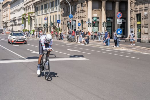 MILAN, ITALY - MAY 30: last stage of Giro 2021, Amanuel Ghebreigzabhier competitor and Trek-Segafredo Team  following car at high speed during individual time trial in city streets, shot on may 30, 2021 Milan, Italy.