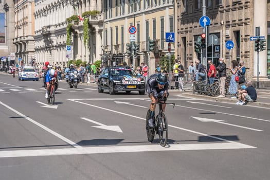 MILAN, ITALY - MAY 30: last stage of Giro 2021, Nikias Arndt competitor of DSM Team and Lars Van Den Berg of Groupama Team  at high speed during individual time trial in city streets with their following cars behind, shot on may 30, 2021 Milan, Italy.