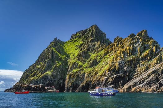 Cruise boats with tourists docking to Skellig Michael island, where Star Wars were filmed, UNESCO World Heritage, Ring of Kerry, Ireland