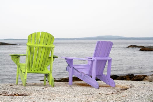 Adirondack chairs with a view on the ocean