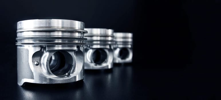 Banner of piston isolated on black background with copy space. Car service and maintenance concept.