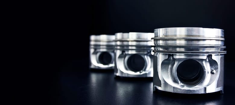 Banner of piston isolated on black background with copy space. Car service and maintenance concept.