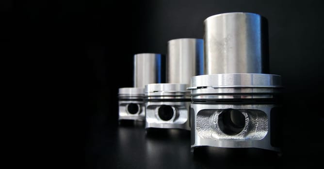 Banner of piston isolated on black background with copy space. Car service and maintenance concept.