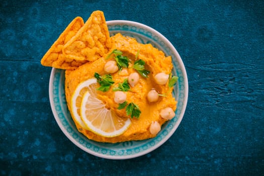 Homemade spicy humus chilli and chickpeas tortilla chips