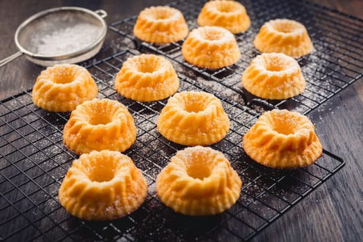 Gugelhupf - homemade lemon cheesecake as bundt cakes on black background