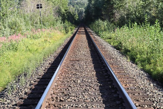 Perspective view of a train track diminishing into the distance.