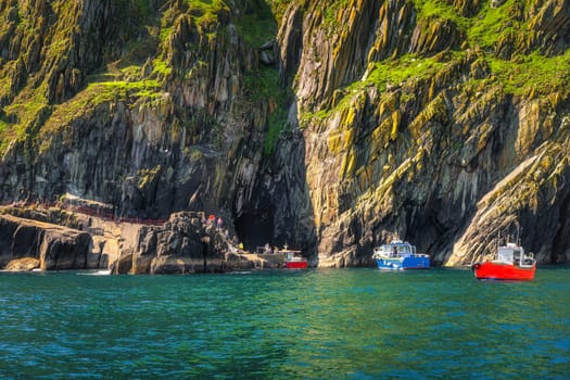 Boats docking to per on Skellig Michael island, tourists on and of boarding. Star Wars film location, UNESCO World Heritage, Ring of Kerry, Ireland