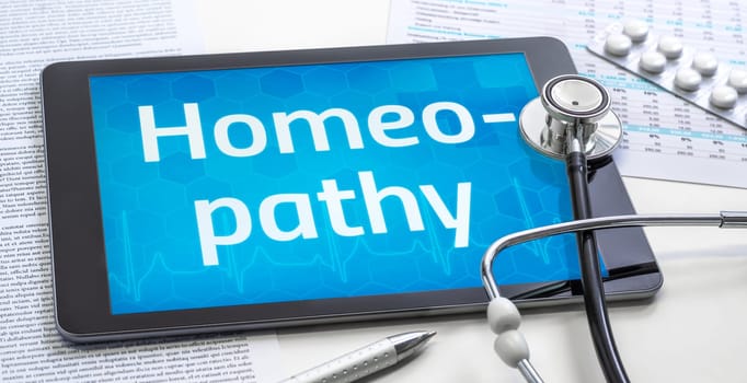 The word Homeopathy on the display of a tablet