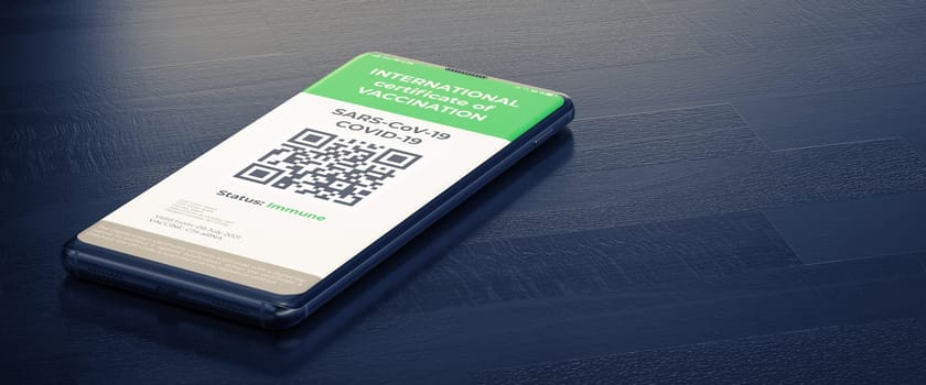 COVID-19: Digital Green Certificates on Smart Phone Screen. A Smart Phone Lying on a Dark Surface with a Vaccinated Digital Health Passport.