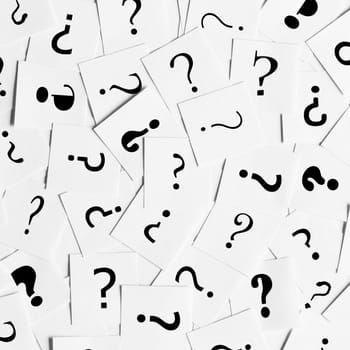 Pile of question mark signs scattered around as a square background. Decision, enquiry or faq concept.