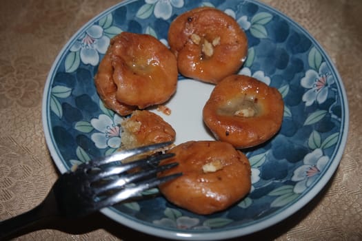 Closeup of delicious and tasty Asian sweet dish called balu shahi or baloshahi or balushahi. This dish is street sweet found in Pakistan India and Bangladesh and served in the festivities.