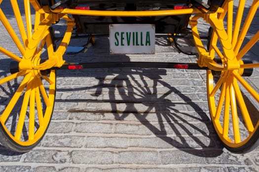 Traditional horse drawn carriage with Seville license plaque. Santa Cruz Neighborhood, Seville, Andalusia, Spain