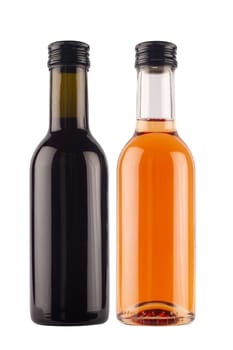 front view of small single serve miniature rose and red wine bottles with no label and black colored metallic screw cap isolated on white background